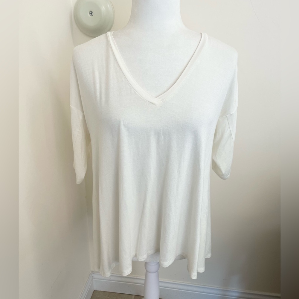 Soft and flowy BCBGeneration 3/4 sleeve  hi-lo back slit top!